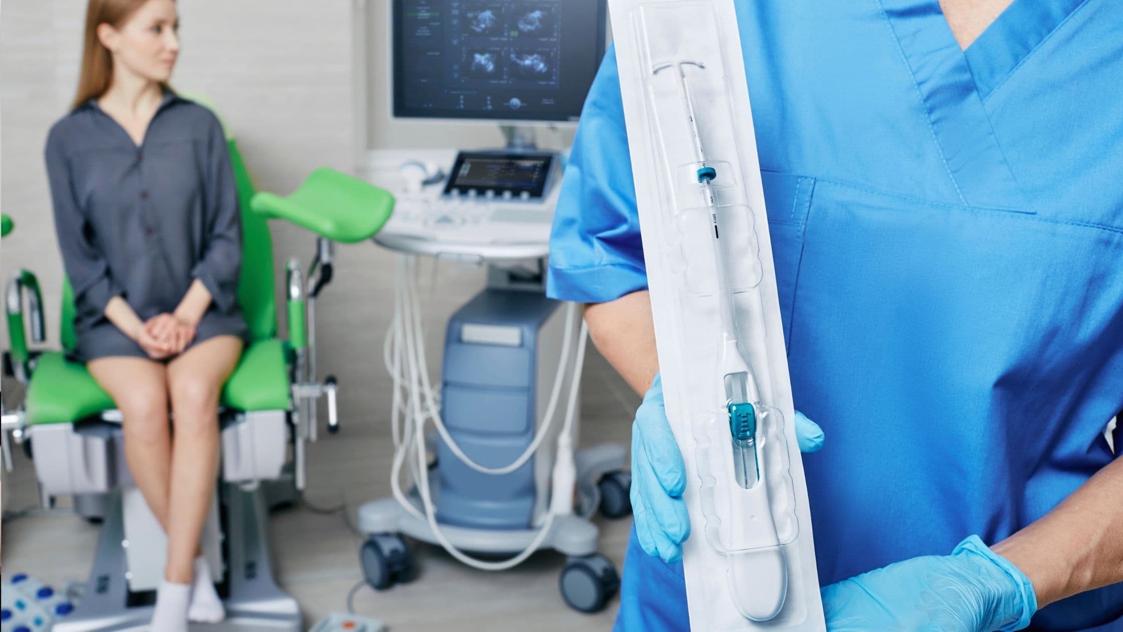 a nurse is holding a syringe in front of a woman sitting in a chair .