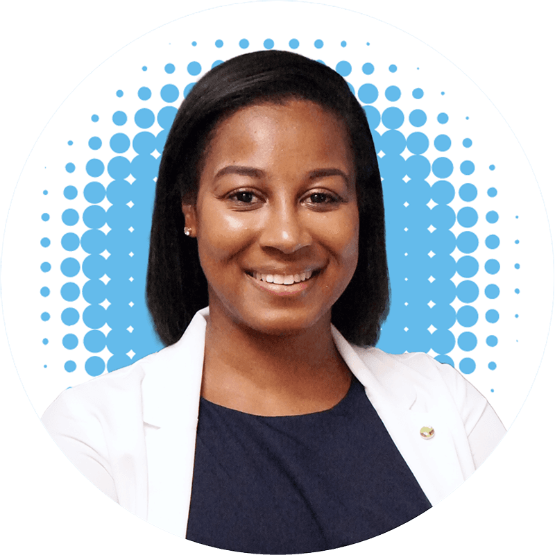 Dr. Laetitia Badio, MD, smiles in front of a blue polka dot background