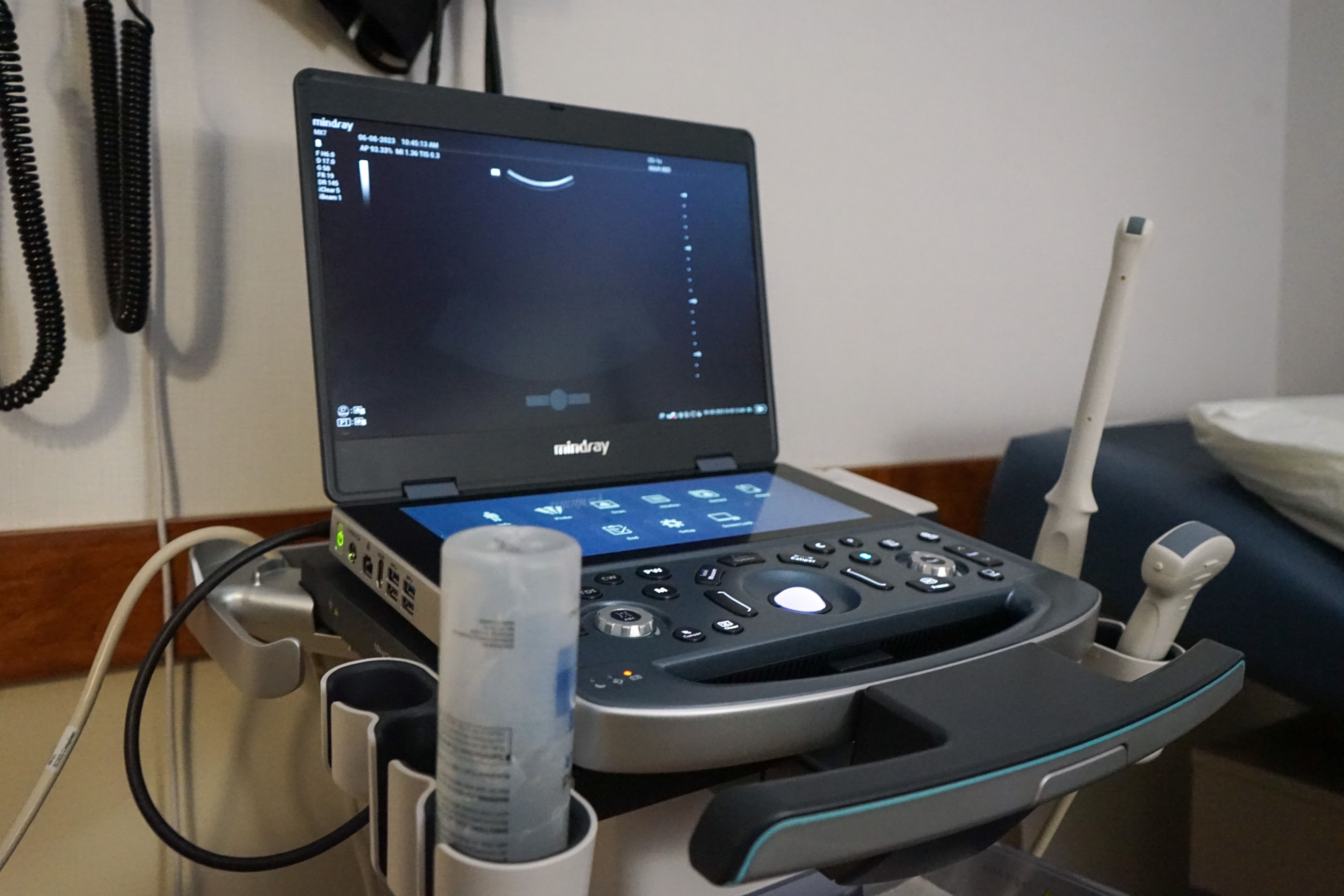 an ultrasound machine is sitting on a table in a doctor 's office .