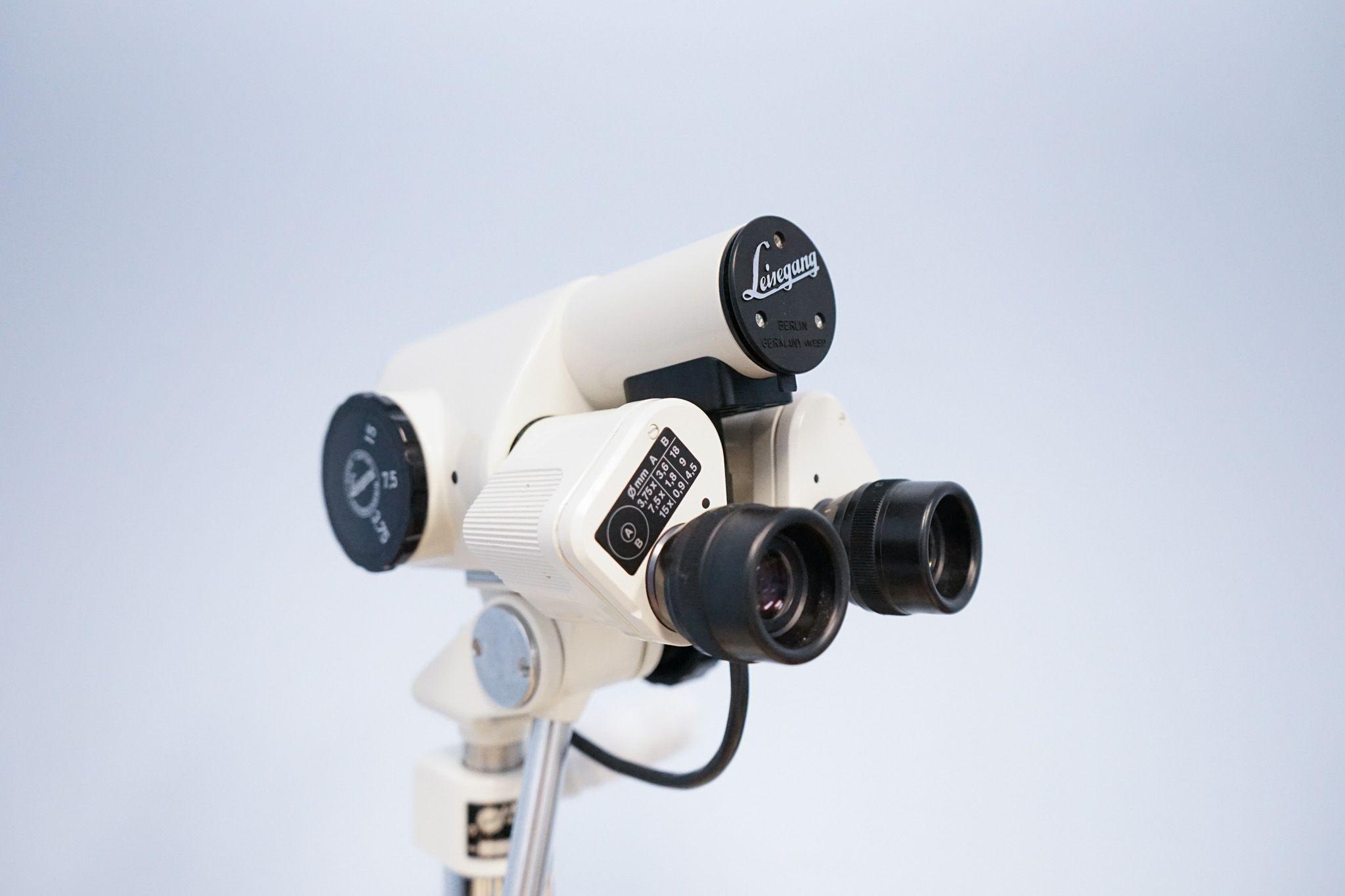 a close up of a microscope on a white background .