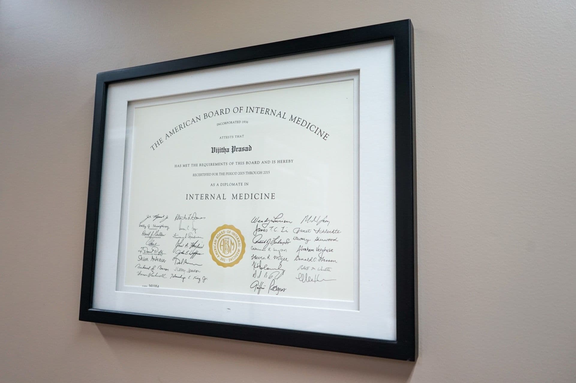 a framed certificate from the american board of internal medicine is hanging on a wall  at South Georgia Internal Medicine at Swainsboro .