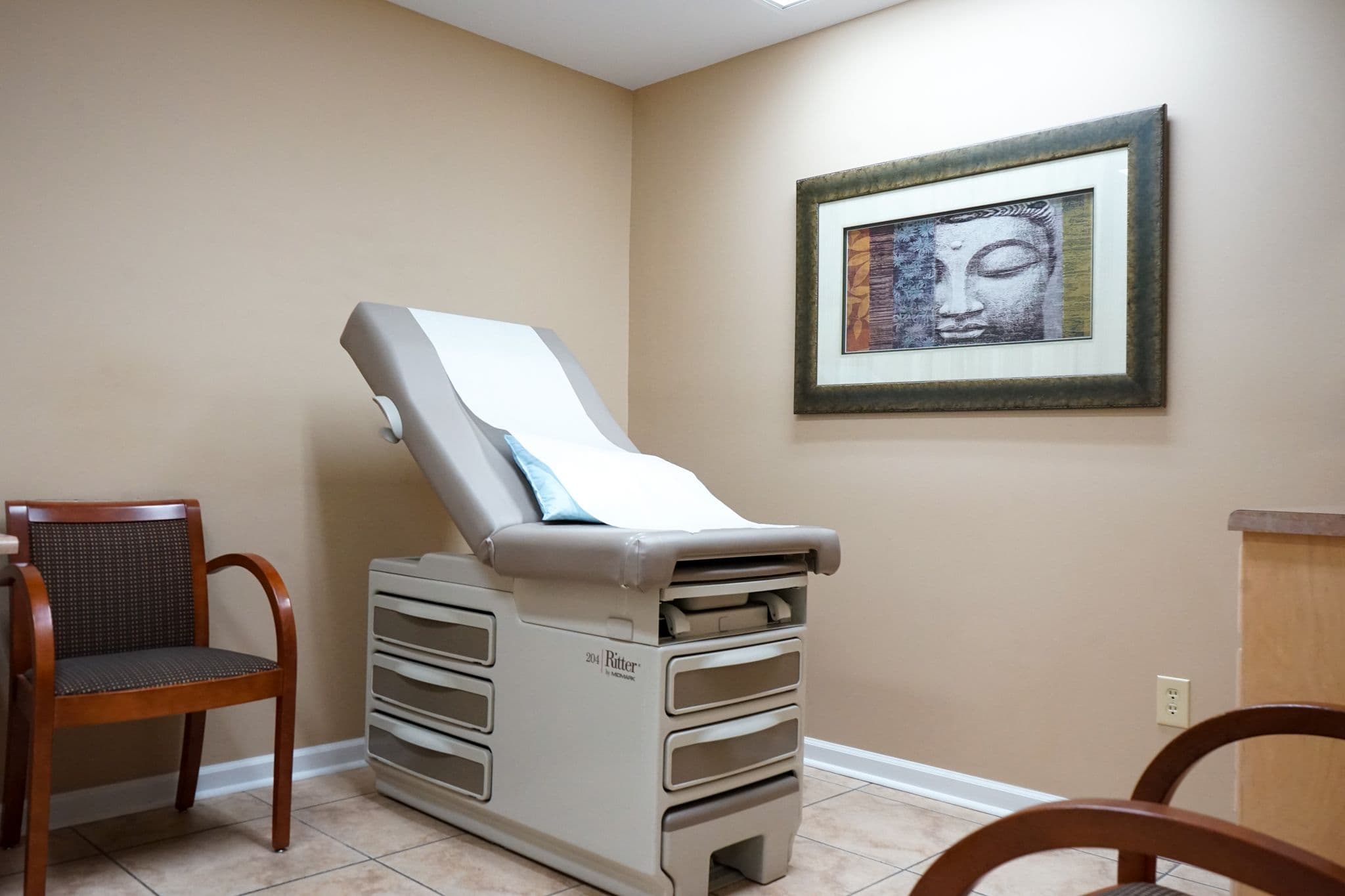 exam room with artwork on the wall at South Georgia Internal Medicine at Swainsboro . 