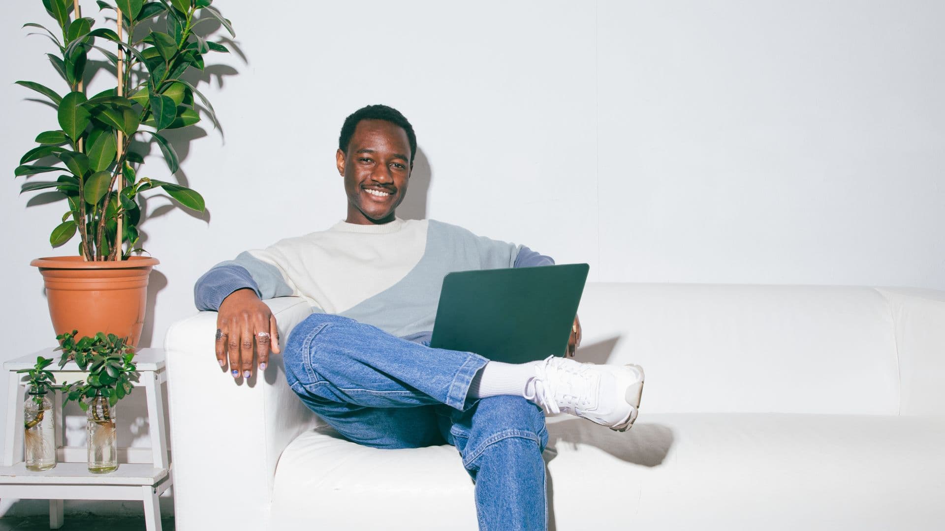 Men's Mental Health: A happy man sitting and smiling