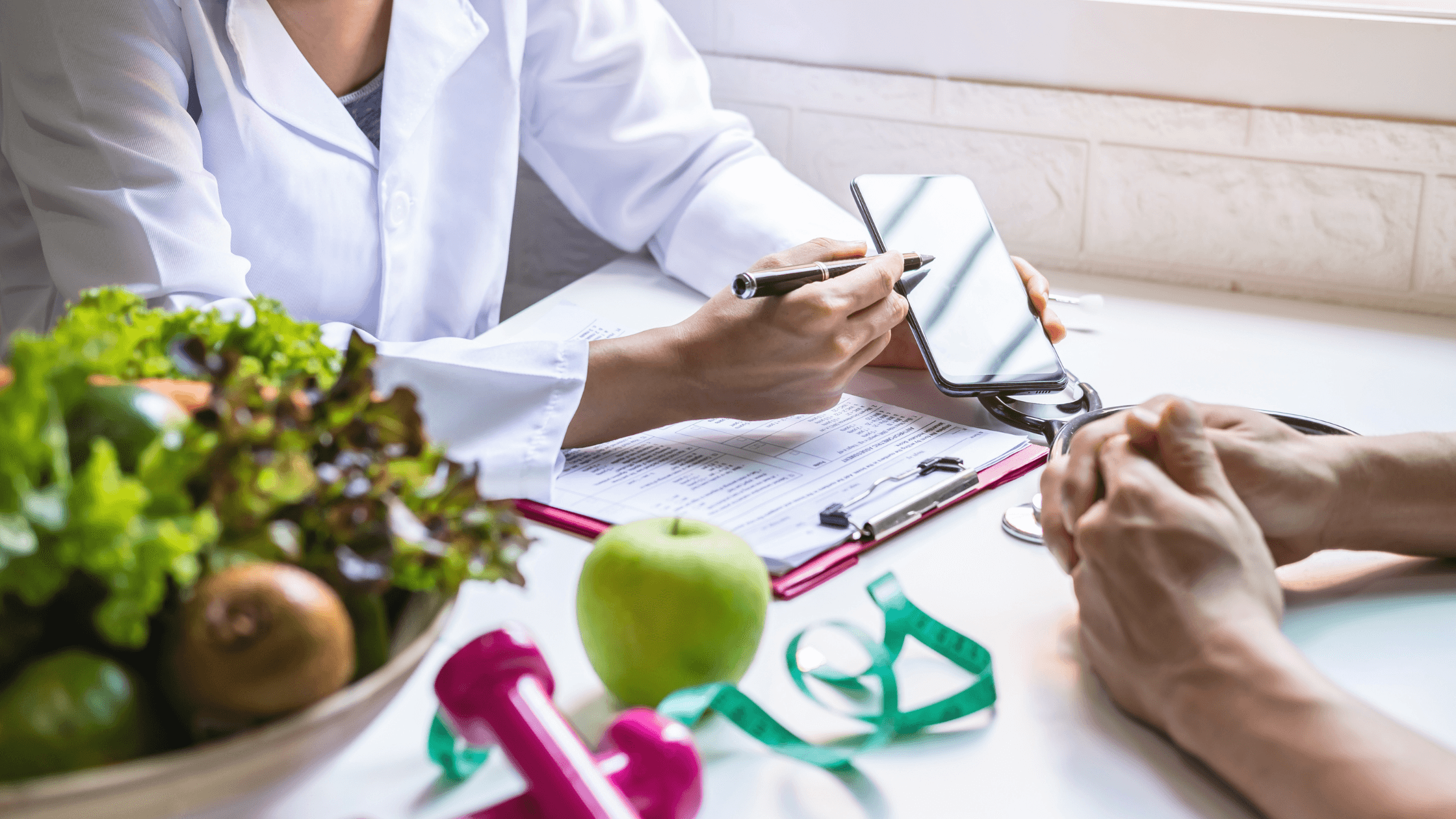 a doctor is talking to a patient while holding a cell phone