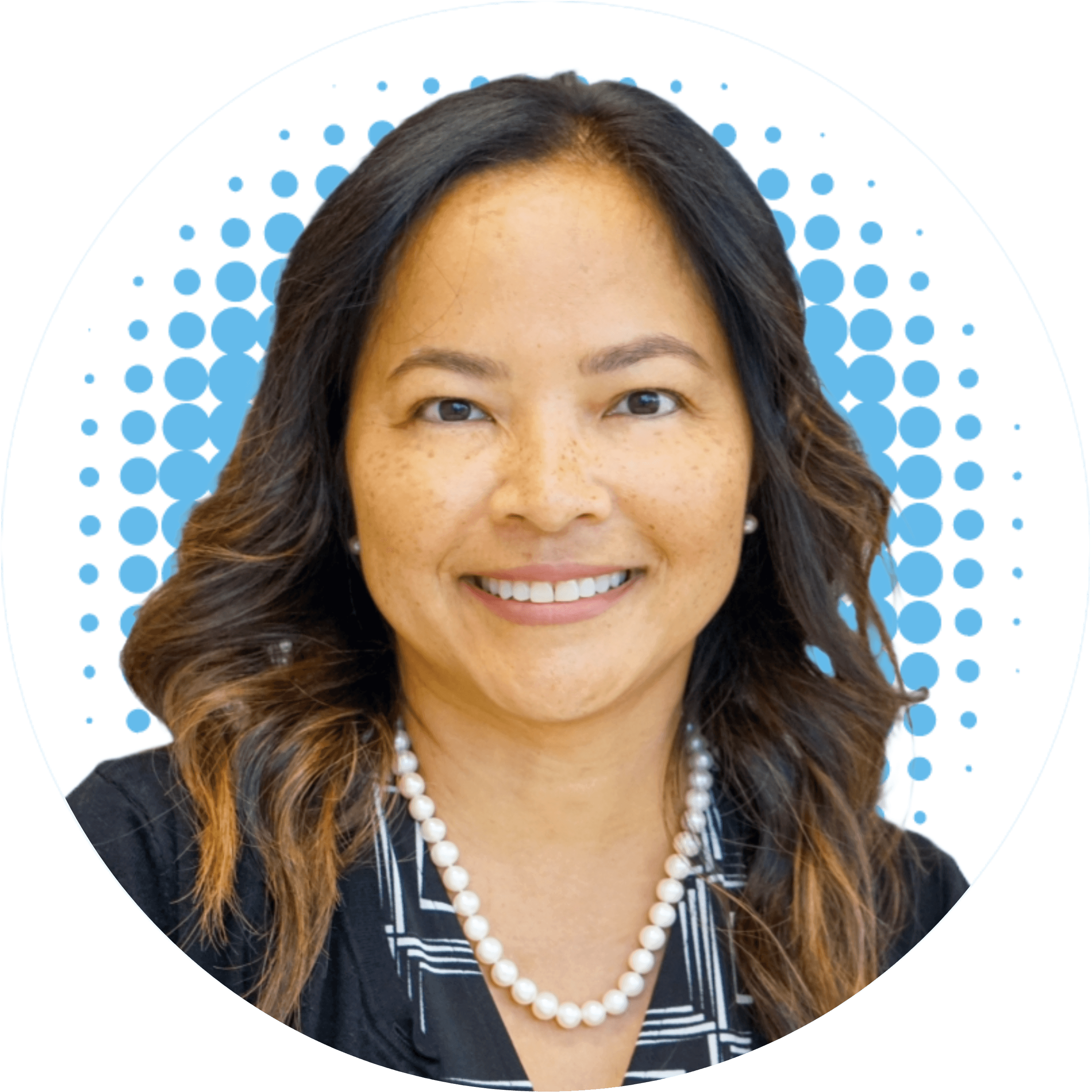 Janie Dinh, FNP-BC wearing a pearl necklace smiles for the camera