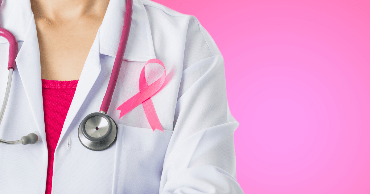a doctor with a pink breast cancer ribbon and a stethoscope around her neck