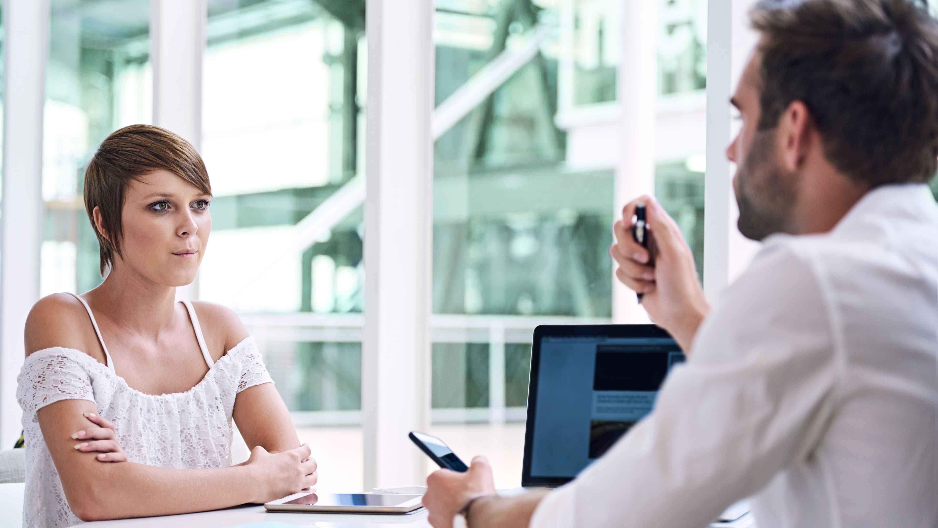 A mom listens attentively to a doctor for health care advice