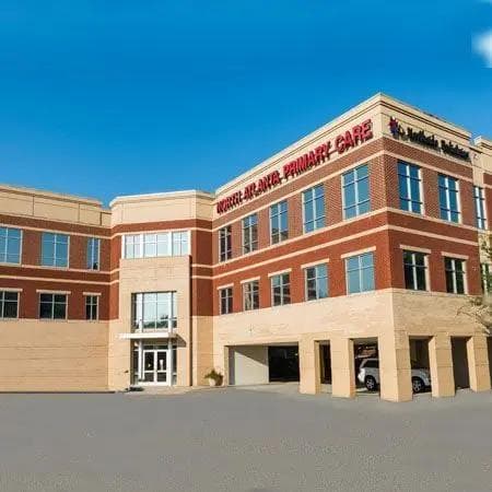 Exterior of the North Atlanta Primary Care building, a multi-story brick and tan medical facility with "North Atlanta Primary Care" and "Northside Hospital" signs.