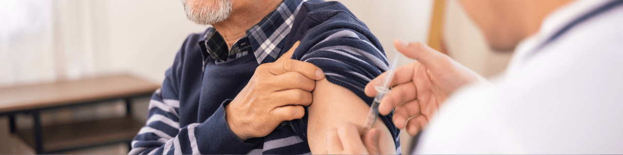Immunization: a man is getting an injection in his arm