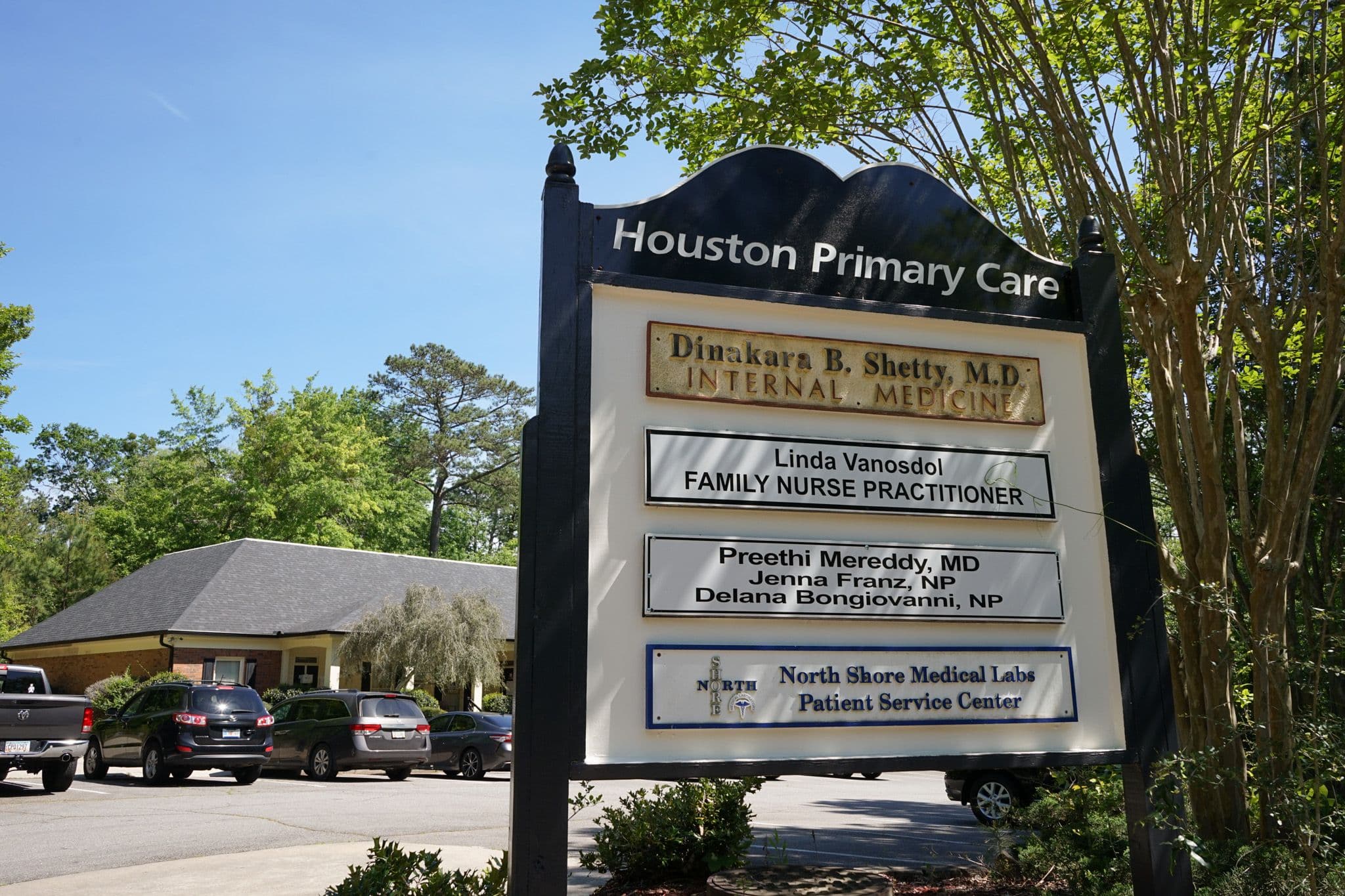 a sign for houston primary care is in front of a building .
