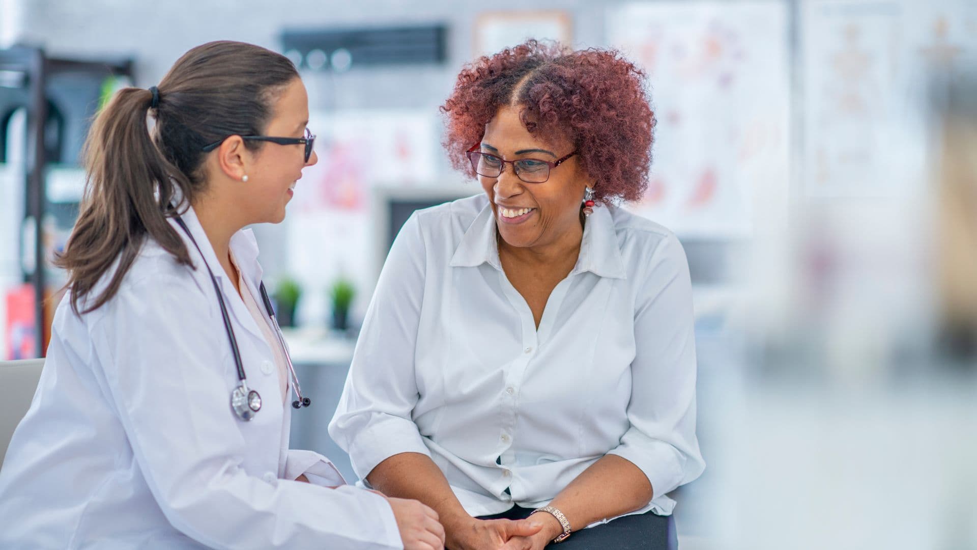 a southeast medical group doctor is talking to a patient regarding her health .