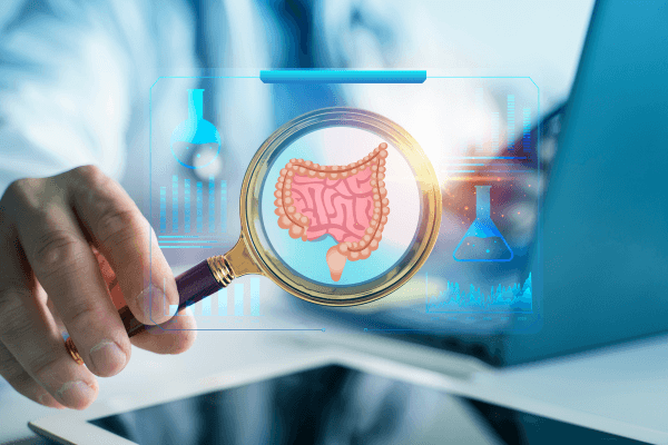 Colon Cancer: Doctor examining digital human intestines with a magnifying glass and holographic medical data.