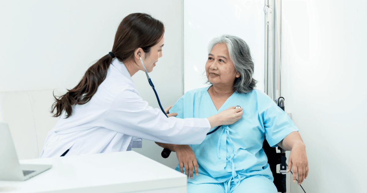 a doctor is listening to a patient 's heartbeat with a stethoscope