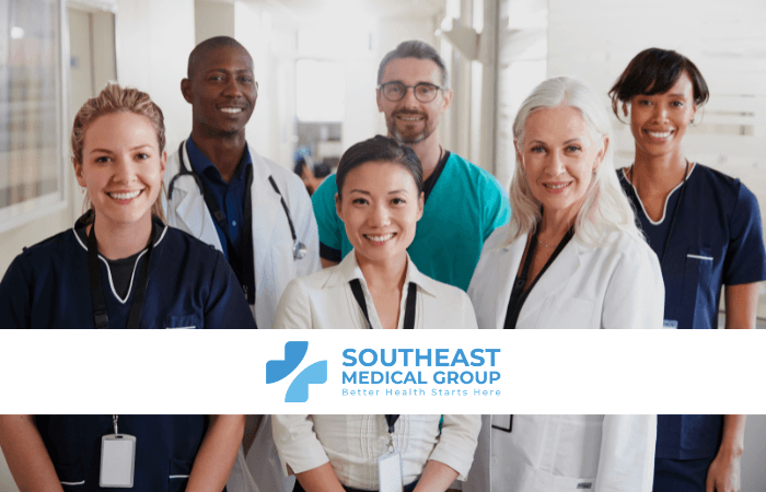 A diverse group of smiling medical professionals with the Southeast Medical Group logo and text.