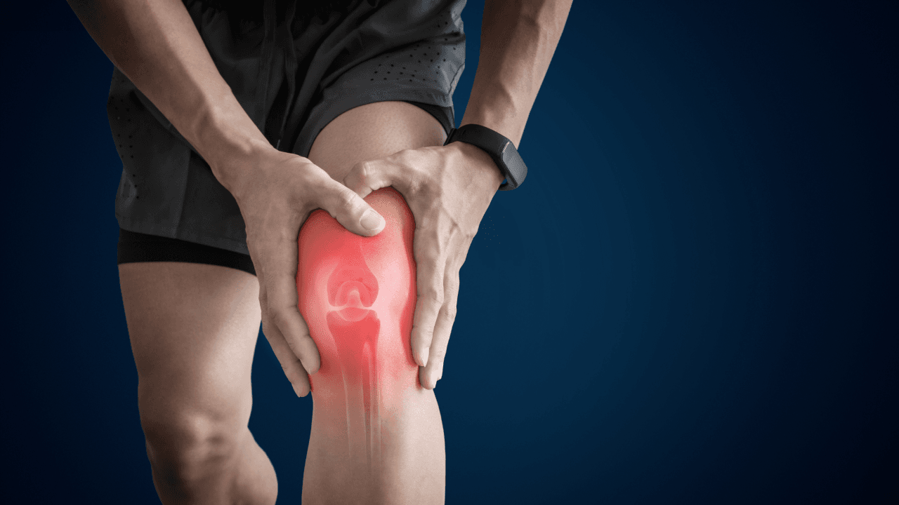 Joint Pain: a man is holding his knee in pain with a red glow