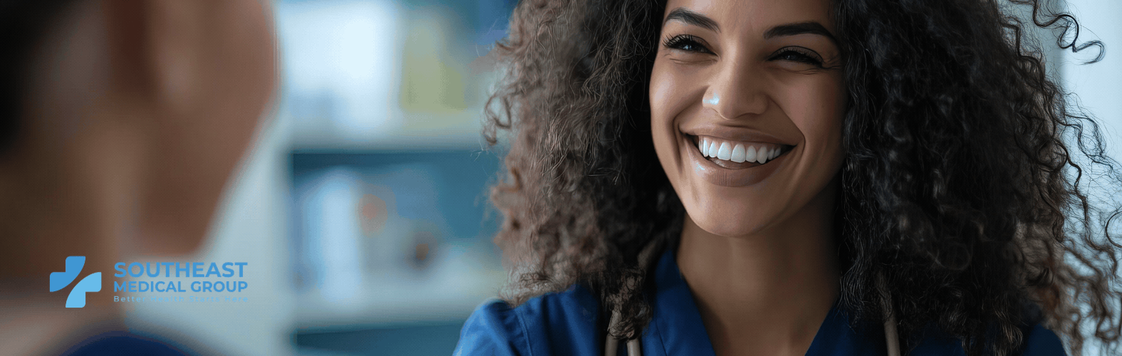 A smiling healthcare professional in blue scrubs and a stethoscope. Southeast Medical Group logo.