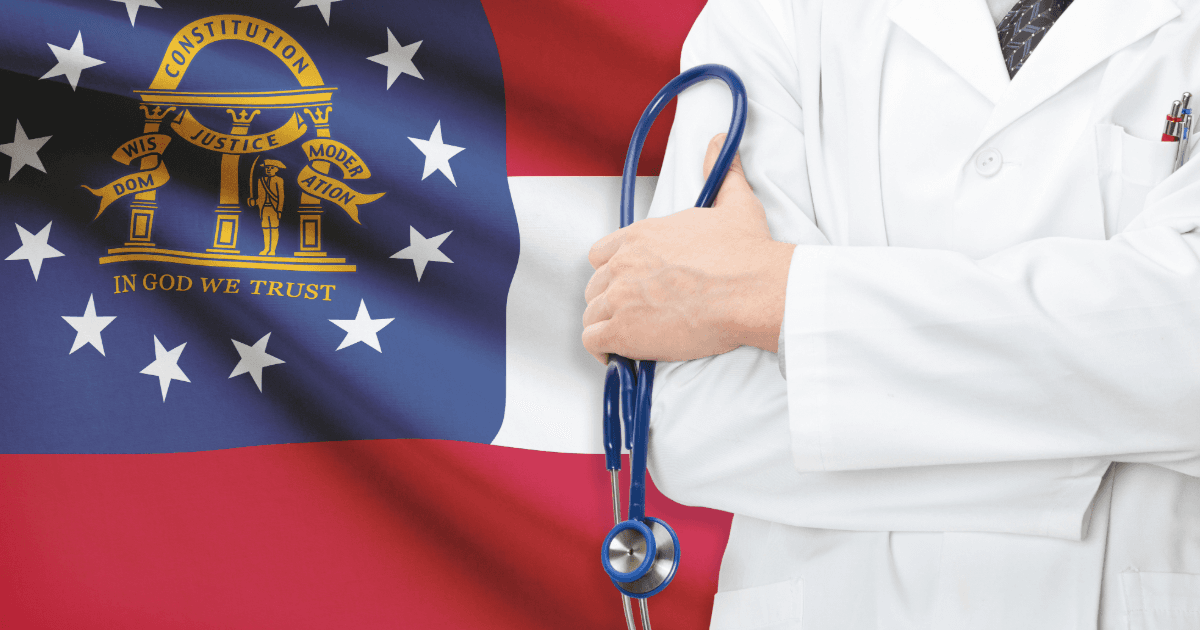 a doctor holds a stethoscope in front of a flag that says constitution