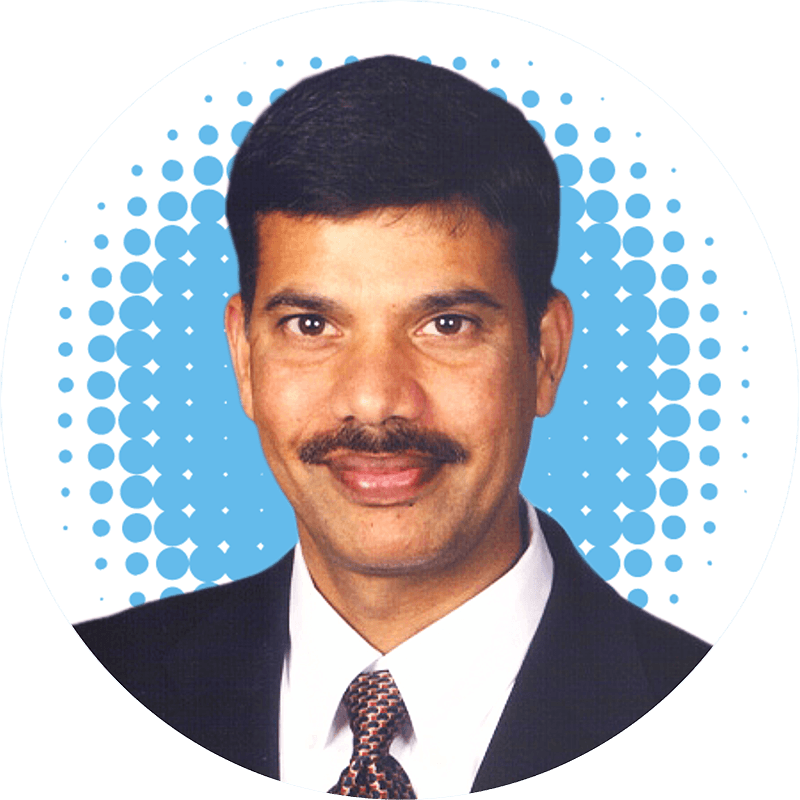 Dr. Karunaker Sripathi, MD wearing a suit and tie