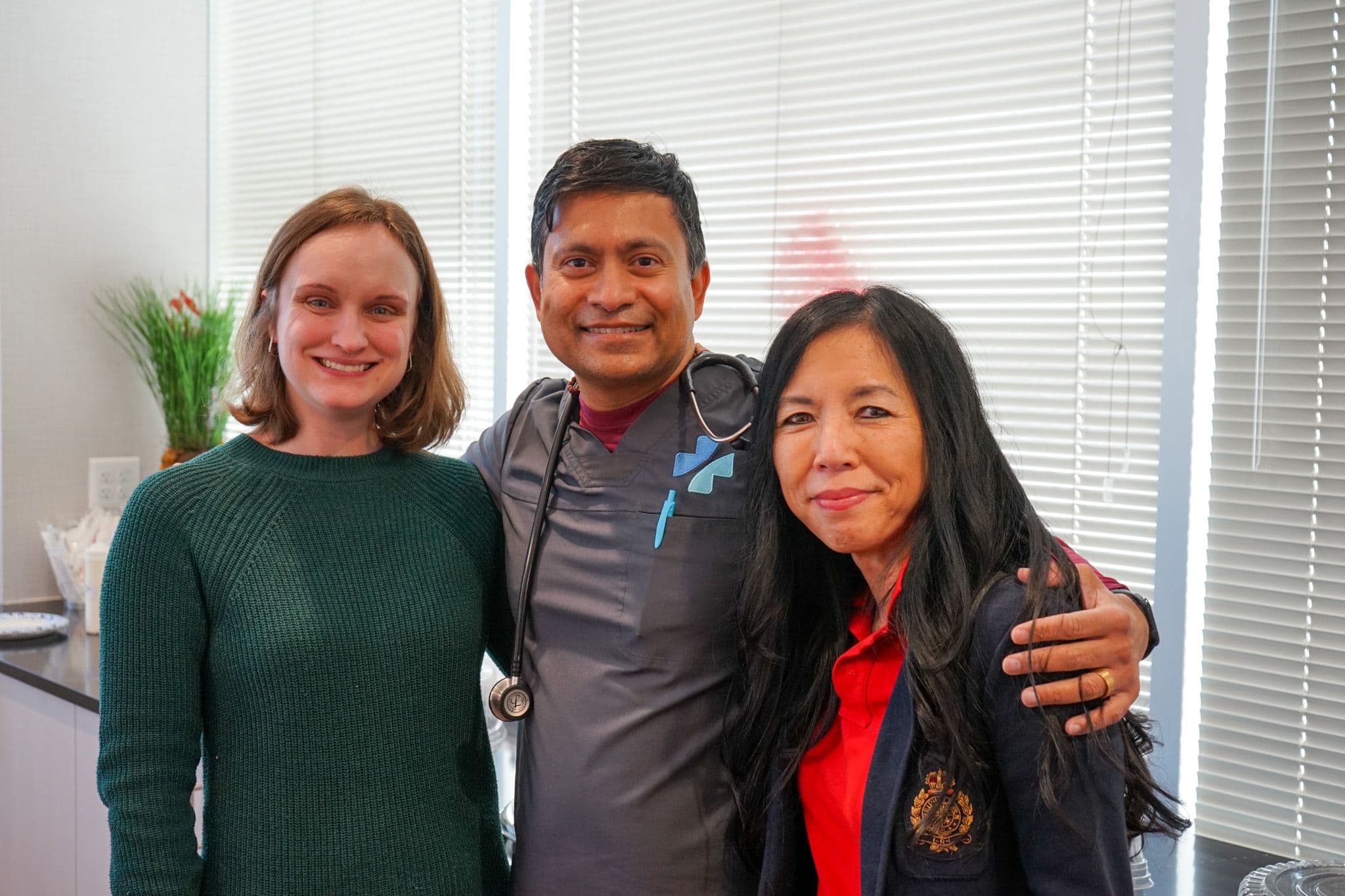 Dr. Danielle Lin (left) and Dr. Satishkumar Ganjam (center), both primary care physicians at North Atlanta Primary Care Alpharetta, celebrate National Doctors Day.