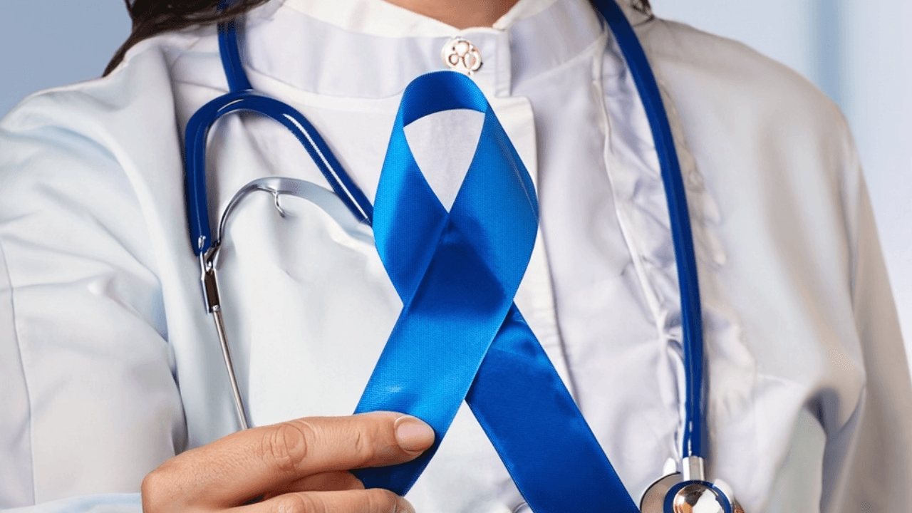 a doctor is holding a blue ribbon with a stethoscope around her neck